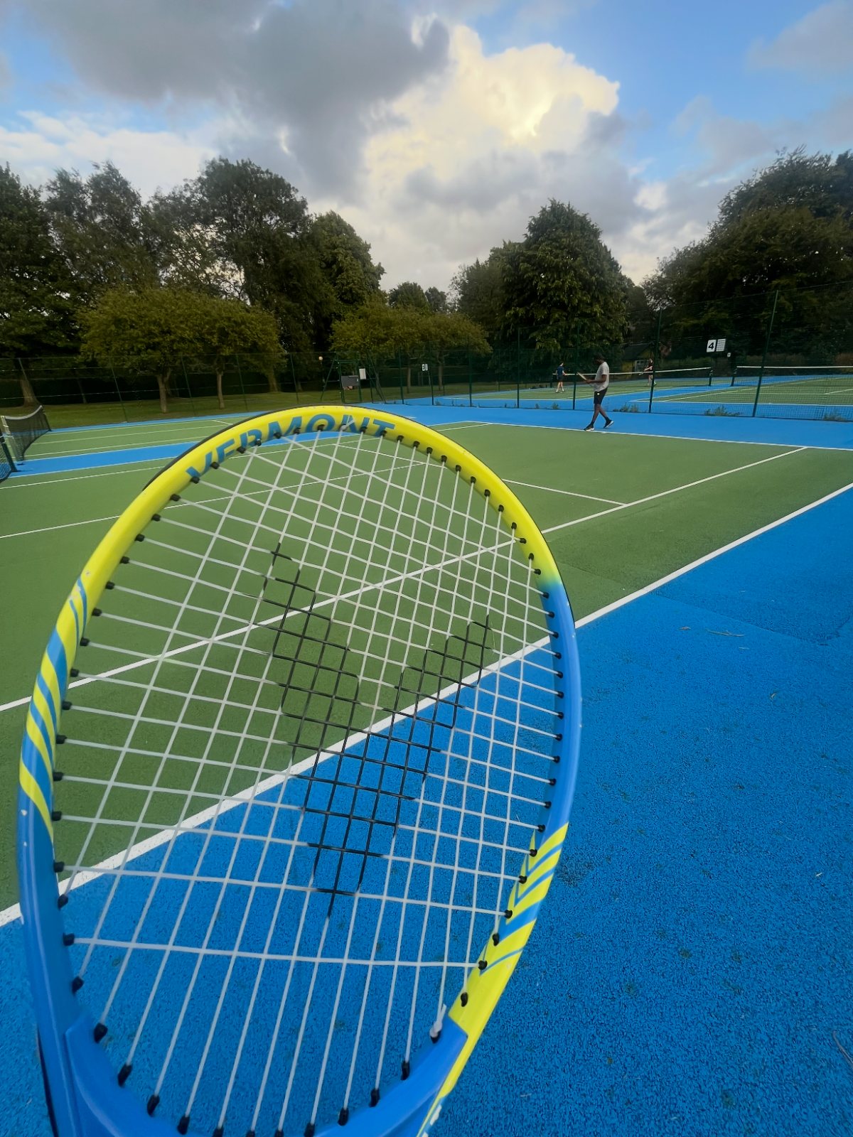 A racket and shuttlecock on a court